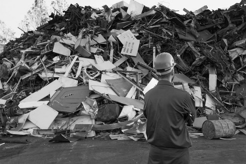 Stacked waste containers ready for transport during a shop strip-out in Wandsworth