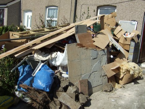 Workers managing construction waste for safety and efficiency