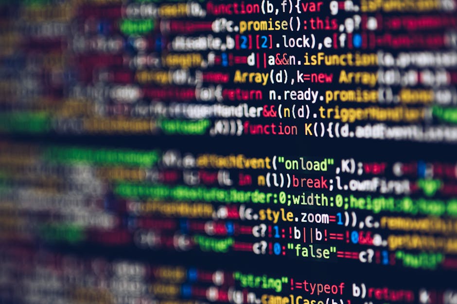 A close-up of a computer screen displaying lines of colorful programming code with syntax highlighting, including various keywords, variables, and functions in shades of red, green, yellow, blue, and 
